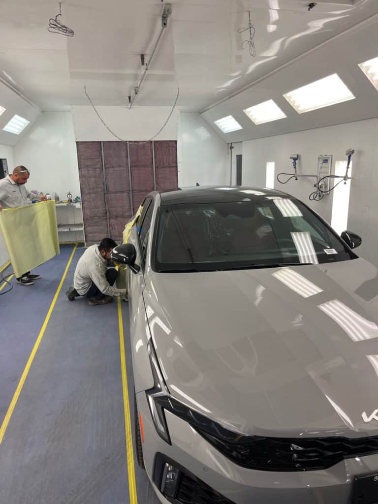 Collision repair work in progress inside Royal Collision shop in Riverside, CA